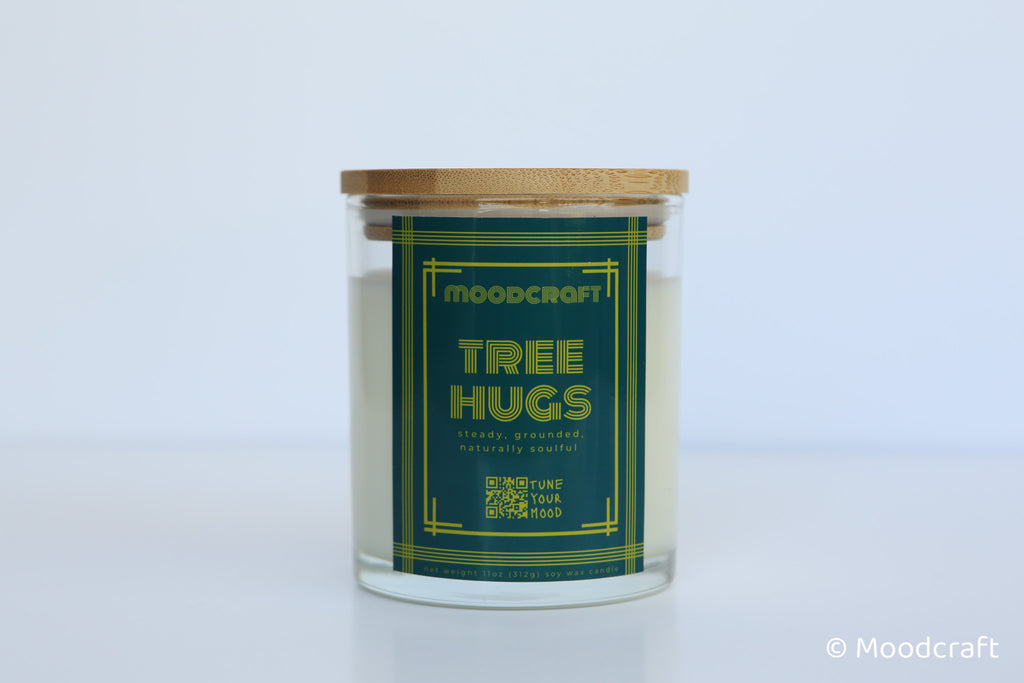 Moodcraft candle labeled 'Tree Hugs' on a white background