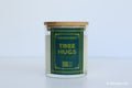 Moodcraft candle labeled 'Tree Hugs' on a white background