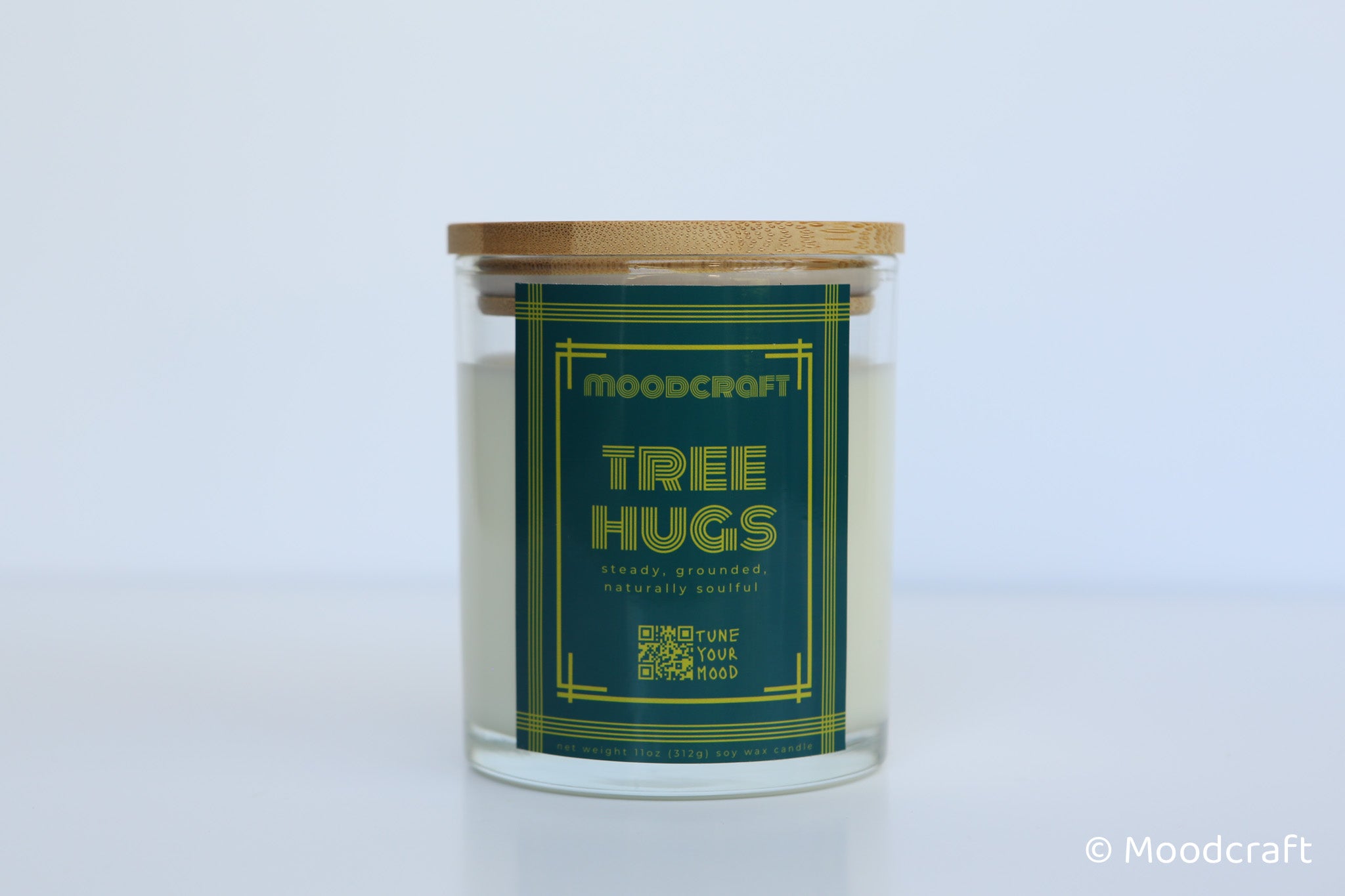 Moodcraft candle labeled 'Tree Hugs' on a white background