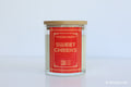 Moodcraft candle with a red label on a light gray background