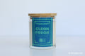 Moodcraft candle with a blue label on a light gray background