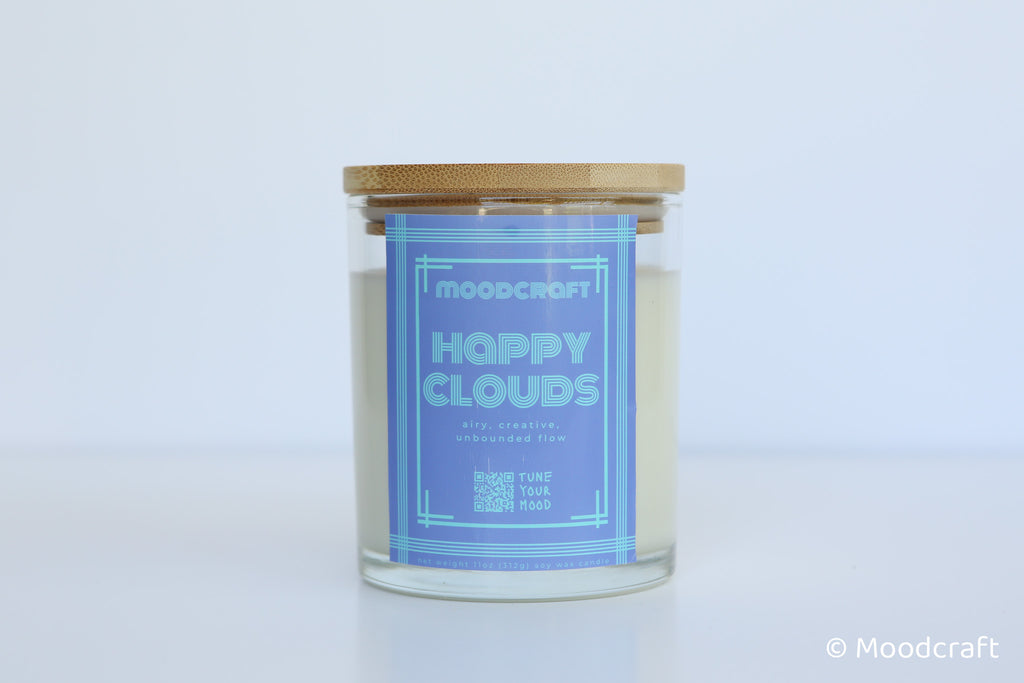 Moodcraft Happy Clouds candle with a blue label on a light gray background