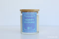 Moodcraft Happy Clouds candle with a blue label on a light gray background