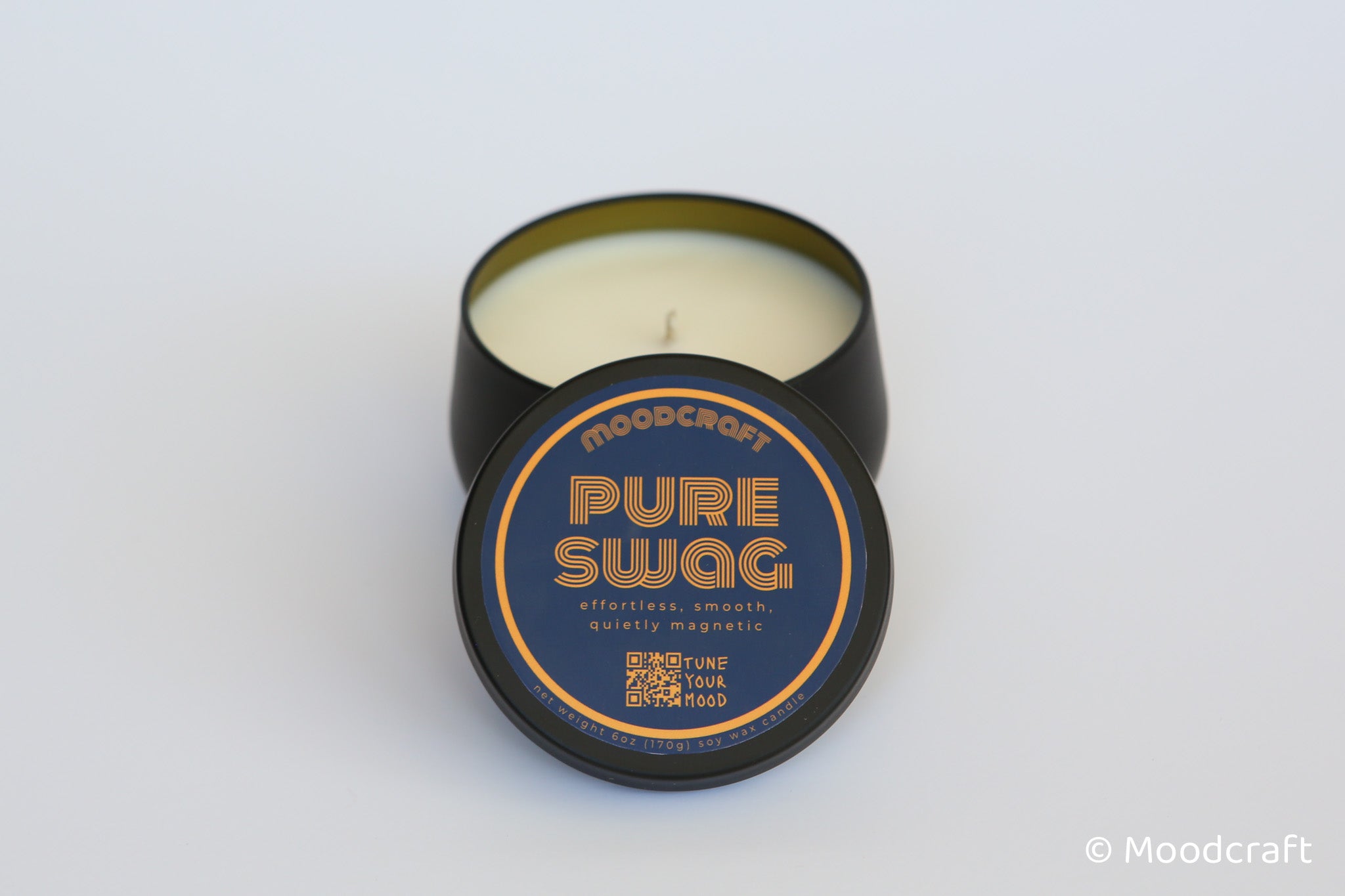 Moodcraft candle with 'Pure Swag' label on a white background