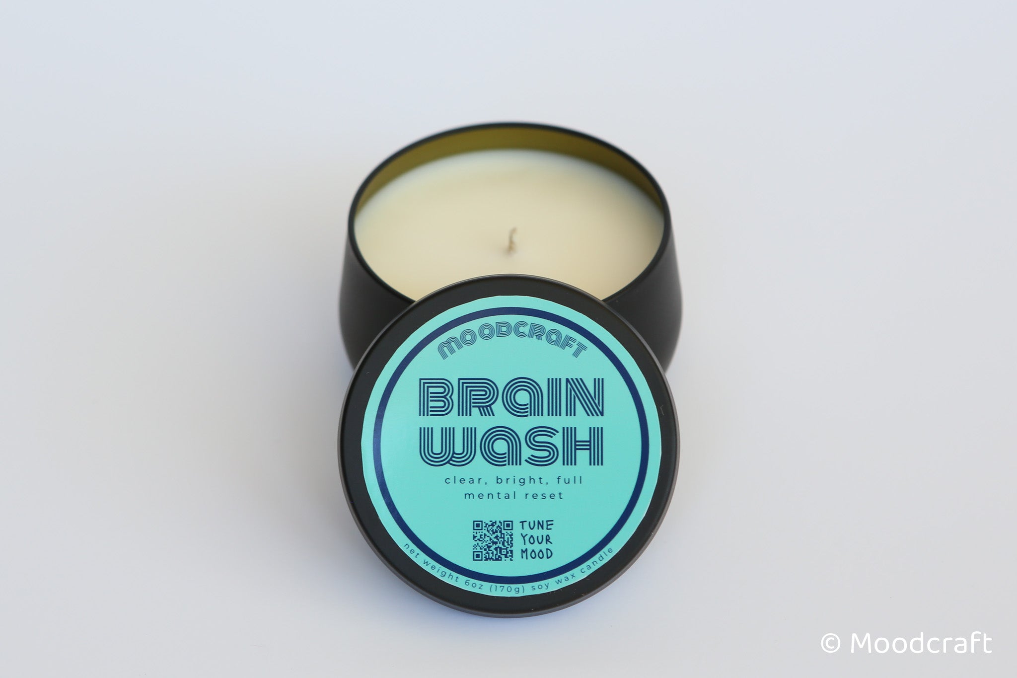 Moodcraft candle labeled 'Brain Wash' on a white background