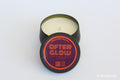 Moodcraft 'After Glow' candle in a black tin on a white background