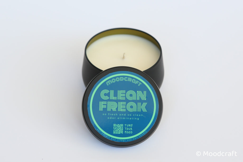 Moodcraft candle in a black container with a blue label on a white background