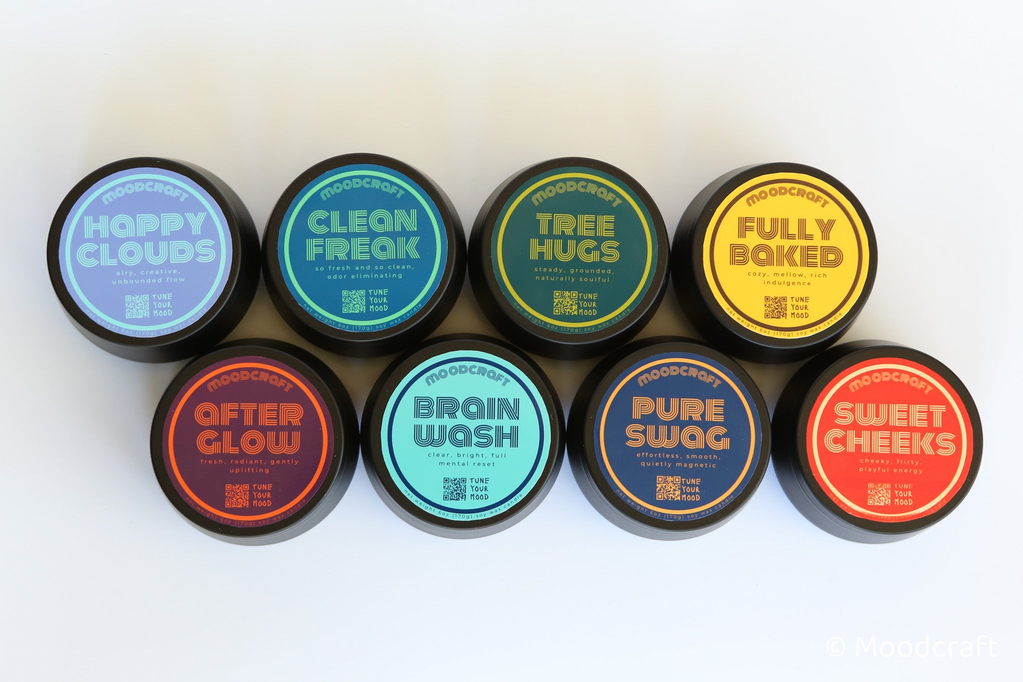 Assorted containers with colorful labels on a white background